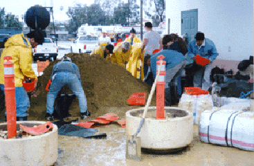 City Crew loading sandbags with EZ Baggers